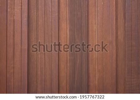 Close up of a massive vertical wooden panel wall.
Concept: background photo