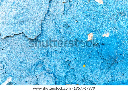 rough cracked blue and white painted wall