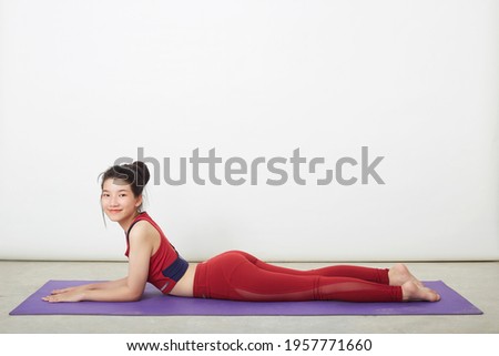 Portrait of young beautiful woman fitness Yoga warm-up exercise position Sporty girl health care lifestyle. Yoga for beginner, wellbeing concept