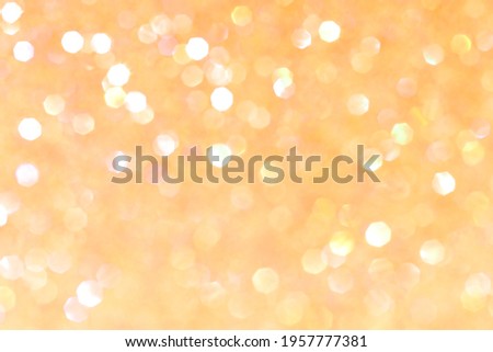 Shiny blurred yellow background with bokeh for a festive mood. Greeting card template for fun. Blurry bokeh