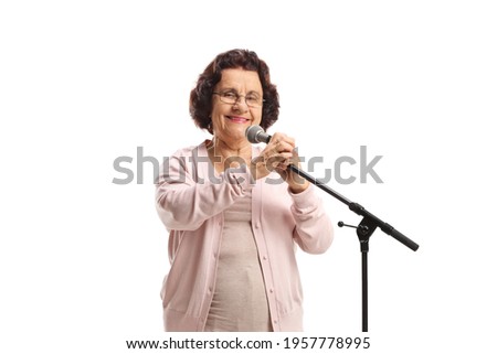Elderly woman with a microphone isolated on white background
