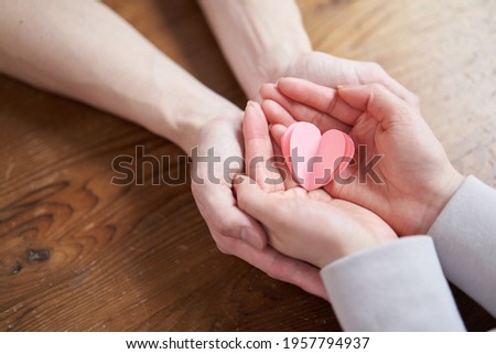Hands of Asian men and women who nurture love