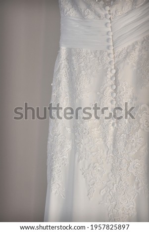 
Details of a bride's dress before putting it on