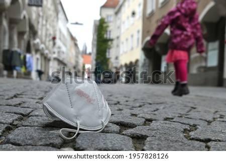 Corona crisis - lockdown - FFP2 mask lies on a street in Steyr, Austria, Europe Royalty-Free Stock Photo #1957828126