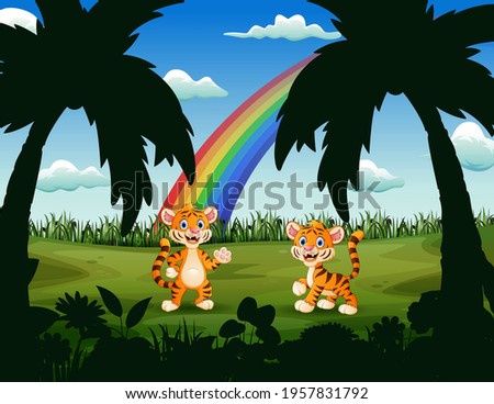 Happy little tigers in the beautiful nature
