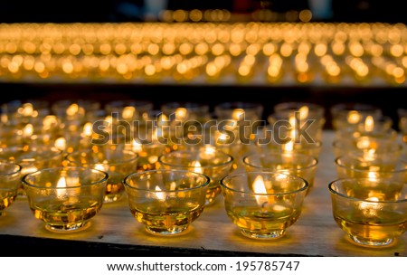 Burning candles at a Buddhist temple