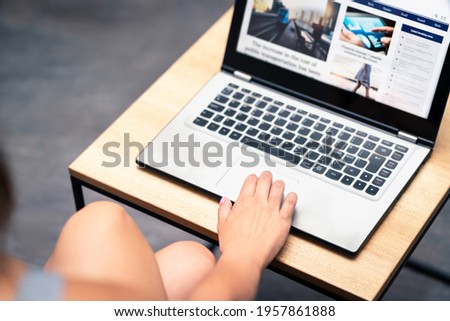 News website design or blog graphic update testing with laptop. Online web page designer, editor or coder working. Responsive site layout by professional UI and UX developer. Www press portal launch. Royalty-Free Stock Photo #1957861888