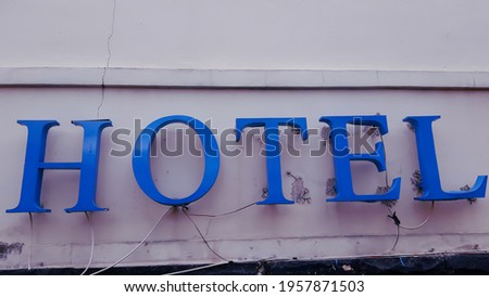 hotel sign in blue color