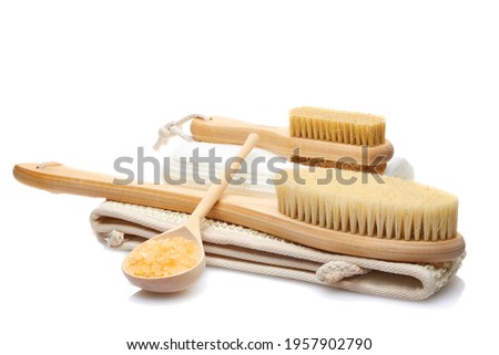 A set of items from natural materials for body care isolated on a white background. Dry massage brush, washcloth, pumice stone and bath salt. Self-care concept Royalty-Free Stock Photo #1957902790