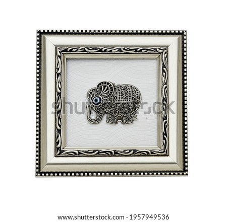 Silver decorative frame. Elephant drawing relief