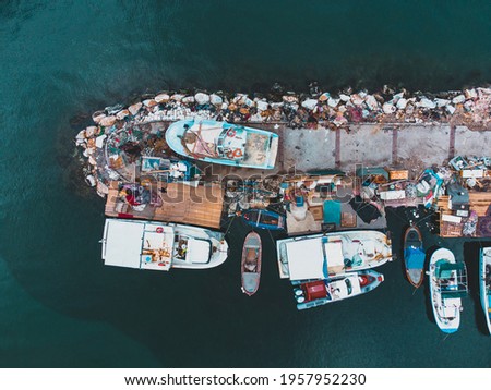 photo taken by drone from above of the fishing boats moored in the harbor