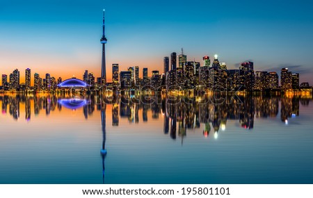 Toronto skyline at dusk, reflected in the Inner Harbor Bay