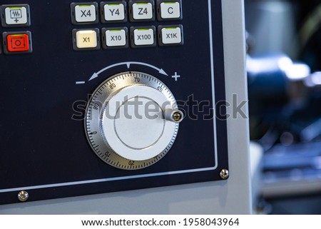 close-up control of the metalworking machine, depth of field, focus blur