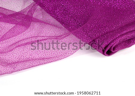 Lightweight pink Crumpled beautifully draped lace festive tulle fabric with sparkles. texture of wedding clothes, veil, dress, skirt. Use for sew fashion industry with copy space. Close up soft focus