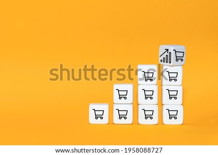 Sale volume increase make business grow. The cube turns over with icon graph and shopping cart symbol. Royalty-Free Stock Photo #1958088727