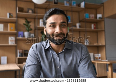 Webcam view of happy smiling businessman teacher talking to employees students looking at camera during learning training, executive manager having videocall laughing teaching. Royalty-Free Stock Photo #1958115688