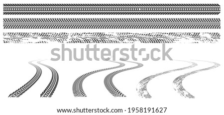 Black car tire tracks, rubber wheel print on road or dirt. Grunge winding trace from vehicle tires isolated on white background. Vector graphic set of tread marks in top and perspective view Royalty-Free Stock Photo #1958191627