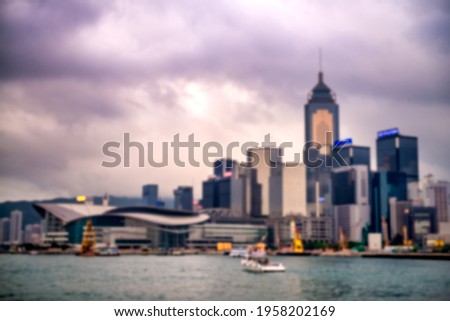 Hong Kong skyline from a moving boat, blurred view.