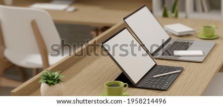 Side view, 3D rendering, portable workspace with two laptops and supplies on wooden table, clipping path, 3D Illustration