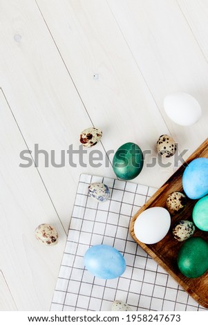 Easter church holiday colorful eggs on chalkboard and wooden table top view