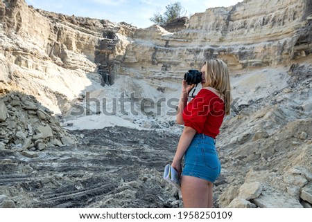 stylish young woman  walking in sand rock in hot summer day, vacation