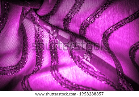 Red silk fabric with dark stripes. Abstract silk tones in ruby tones. Vintage pattern on the fabric. Background texture, decorative ornament
