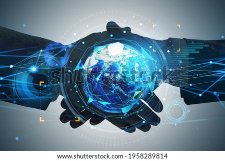 Businesspeople handshake over Earth planet hologram symbolizing worldwide fintech industry at international business. Tech interface. Elements of this image furnished by NASA