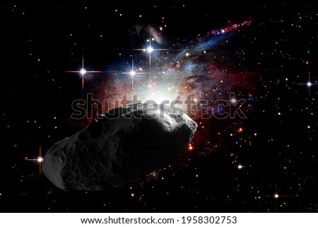 Asteroid flying in the deep space. Elements of this image furnished by NASA.

