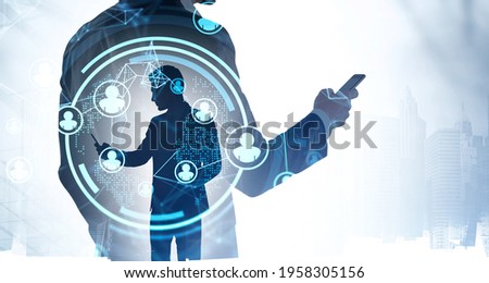 Office man using smartphone, blue hud glowing hologram with data information, double exposure with skyscrapers. Concept of manager in global communication and technology