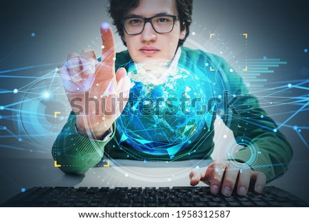 Businessman in glasses touching hologram screen to choose a business option. Planet Earth. Concept of fintech industry. Globe and tech interface. Elements of this image furnished by NASA
