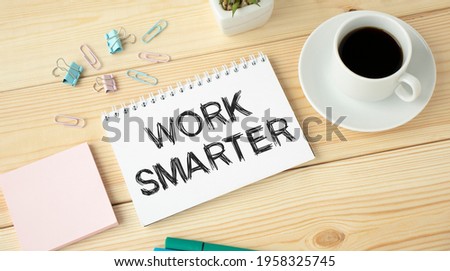 Work Smarter, Business Concept. Notebooks, pen and cup coffee on a wooden table.