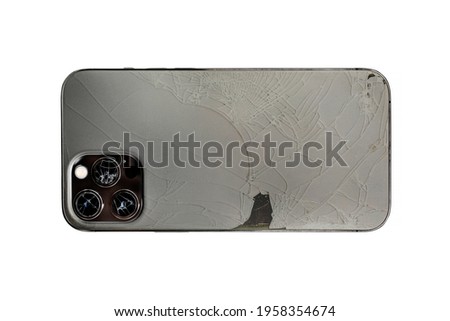 Broken lens and back side of smartphone, isolated white background, back side, lens, camera
