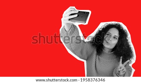 Young woman taking selfie, fashion magazine style