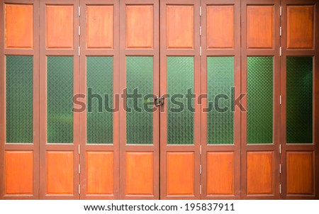 Brown wood and green glass door