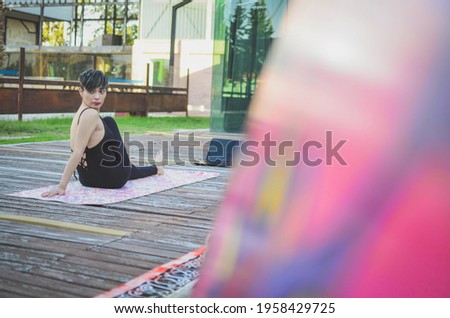 woman bench doing yoga outdoors