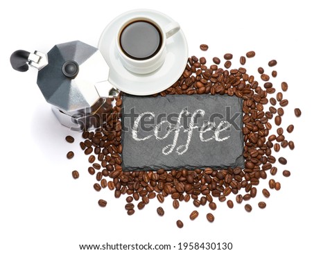 stone serving board with chalk handwritten sign, cup of espresso and coffee beans on white background