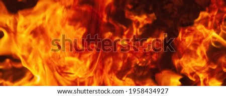 Dramatic pictures of fire flame background as symbol of hell and eternal pain. Horizontal image for design