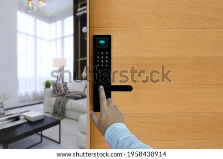 Fingerprints or finger scan to open digital door lock, Apartment, condominium door control system using digital door locking. Smart Security, safety concept. Royalty-Free Stock Photo #1958438914