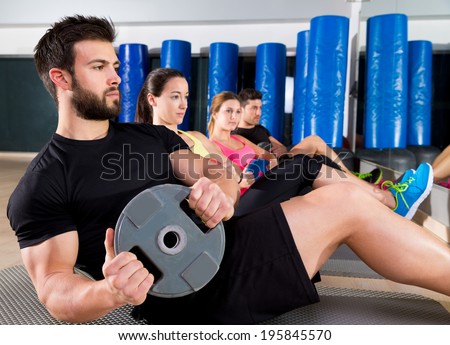 Abdominal plate training core group at gym fitness workout Royalty-Free Stock Photo #195845570