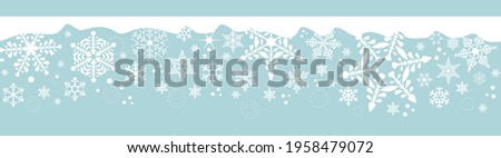 Snowflakes border with ice and falling snow flakes