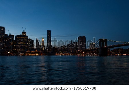 Skyline at the blu dusk from the Brooklyn Bridge