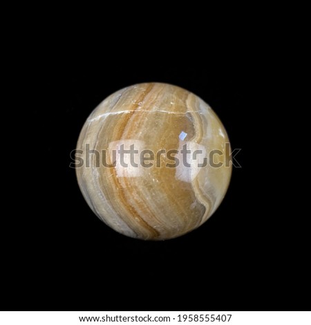 marble ball on a black background. ball with marble texture