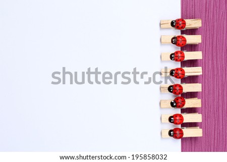 Abstract background with colorful wooden pins and paper