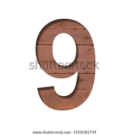 Font on the boards. The digit nine, 9, is cut out of paper against the background of a wooden plank wall. Volumetric white fonts set
