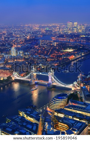 London aerial view panorama at night with urban architectures and Tower Bridge.