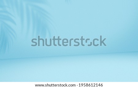 Empty palm shadow blue color texture pattern cement wall background. Used for presentation  business nature organic cosmetic products for sale shop online. Summer tropical beach with minimal concept