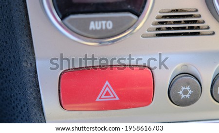 4-way flasher red button inside the car