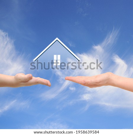 real estate and family home concept - closeup picture of child and female hands holding transparents  house shape