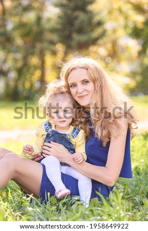 Mother with daughter. Happy family portrait. Single parent. Nature autumn background. Two people. Summer park lifestyle. Motherhood concept. Home outdoors life
