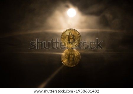 Golden Bitcoin on dark backround. New virtual money. Crypto currency. Creative artwork decoration. Selective focus